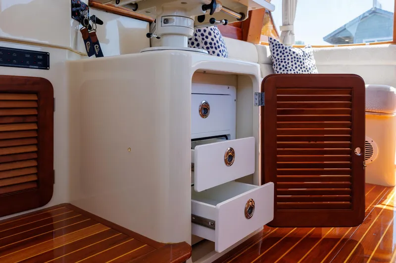 Slide: The Image of Interior of 2009 Hinckley Talaria 44 MY yacht with open wooden cabinet and drawers. - 41