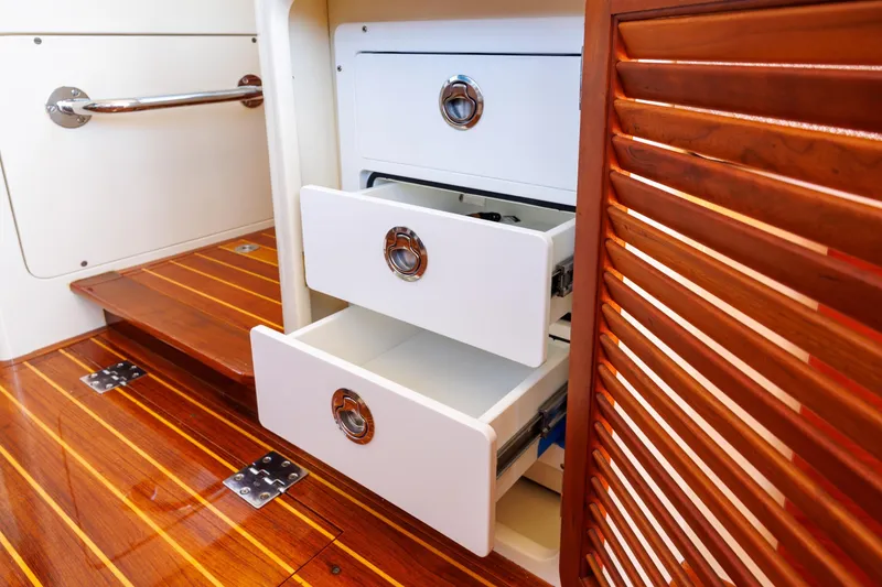 Slide: The Image of Interior of 2009 Hinckley Talaria 44 MY yacht with open drawers and wooden flooring. - 42