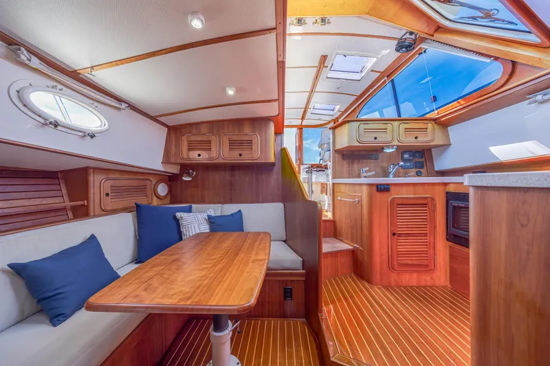 Slide: The Image of Interior of 2009 Hinckley Talaria 44 MY yacht with wooden finishes and cozy seating area. - 45