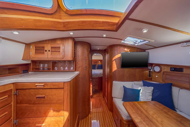 Slide: The Image of Luxurious interior of 2009 Hinckley Talaria 44 MY yacht with wood finishes and modern amenities. - 49