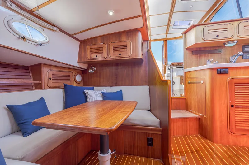 Slide: The Image of Interior of 2009 Hinckley Talaria 44 MY yacht with wooden finishes and cozy seating area. - 50