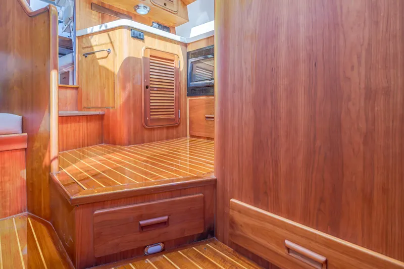Slide: The Image of Luxurious wooden interior of 2009 Hinckley Talaria 44 MY yacht, showcasing elegant craftsmanship. - 51