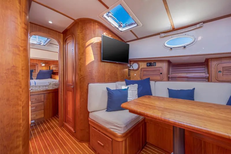 Slide: The Image of Luxurious interior of 2009 Hinckley Talaria 44 MY yacht with wood finish and seating area. - 52