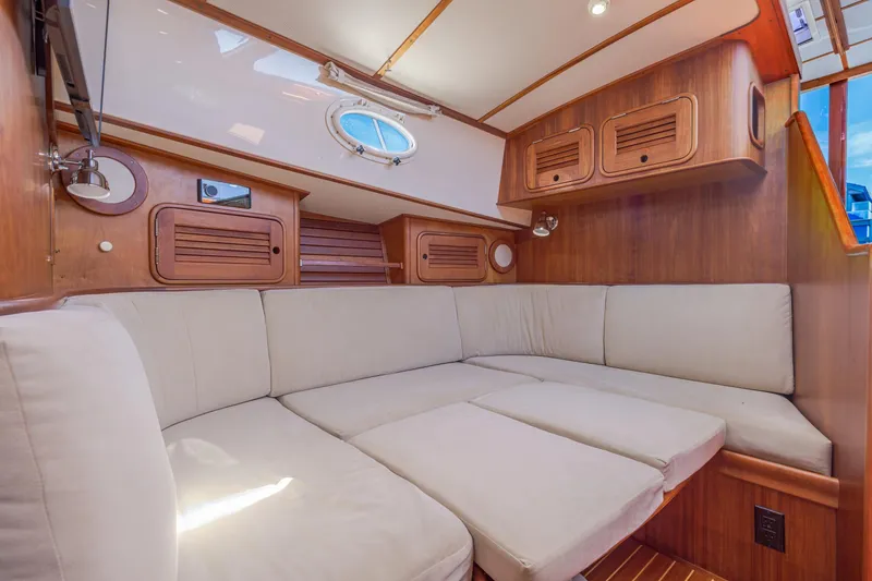 Slide: The Image of Luxurious interior of 2009 Hinckley Talaria 44 MY yacht with plush seating and wooden accents. - 54