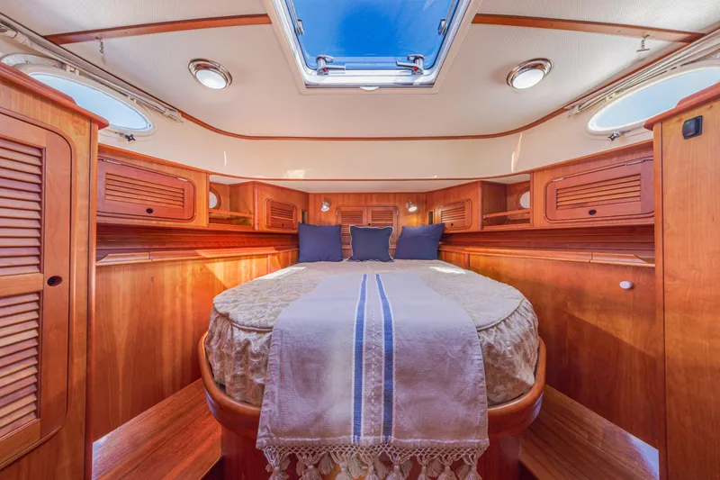 Slide: The Image of Luxurious cabin interior of 2009 Hinckley Talaria 44 MY yacht with wooden finishes. - 56
