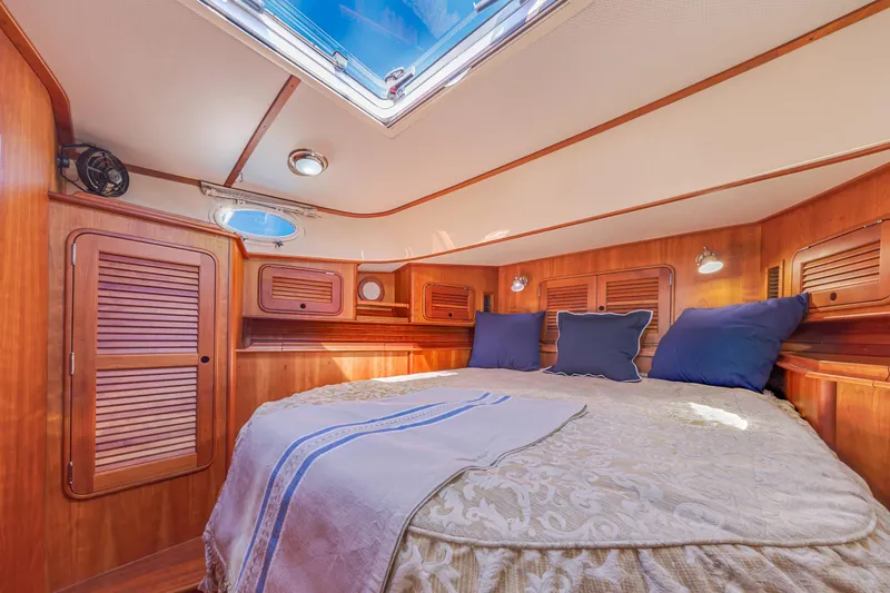 Slide: The Image of Luxurious cabin interior of 2009 Hinckley Talaria 44 MY yacht with skylight and wood finish. - 57