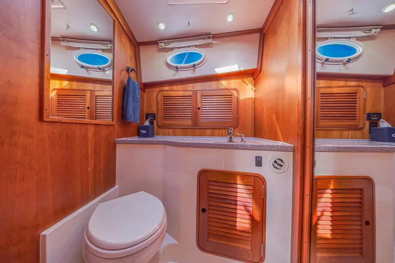 Slide: The Image of Luxurious 2009 Hinckley Talaria 44 MY yacht bathroom with wood accents and modern fixtures. - 63