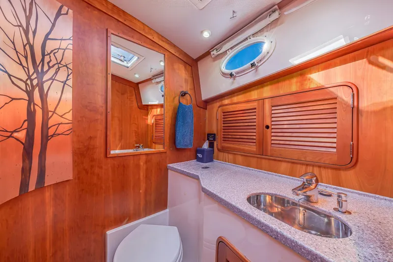 Slide: The Image of Luxurious 2009 Hinckley Talaria 44 MY yacht bathroom with wood accents and modern fixtures. - 64