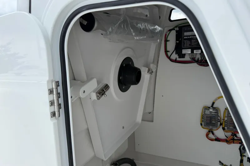Slide: The Image of Interior view of 2026 Sportsman Heritage 231 Center Console boat's storage compartment. - 8