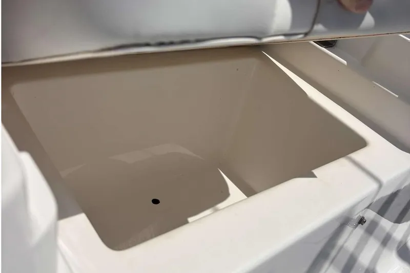 Slide: The Image of Open storage compartment on 2023 Tides 26 boat, showcasing spacious interior design. - 32