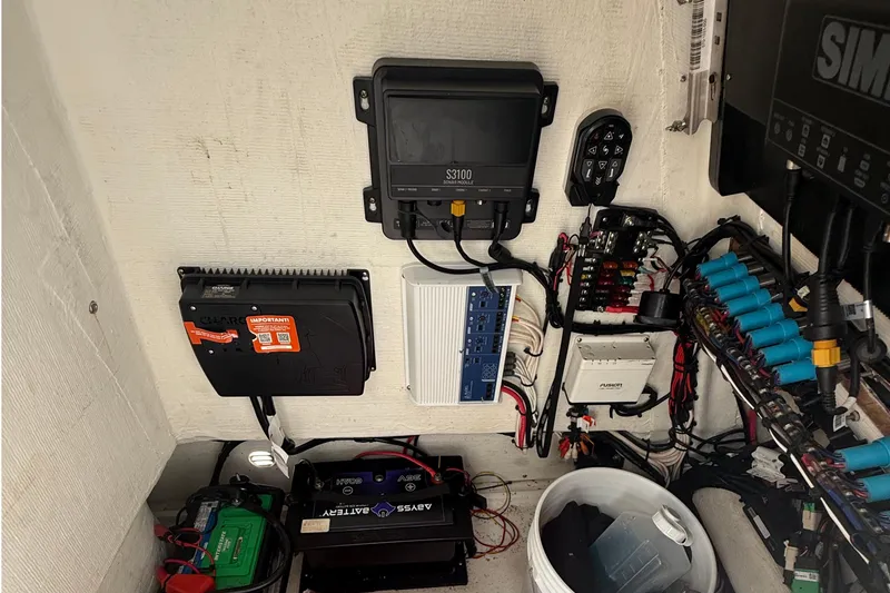 Slide: The Image of Electrical system setup in a 2023 Tides 26 boat, featuring various components and wiring. - 34