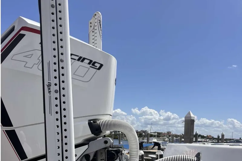 Slide: The Image of 2023 Tides 26 boat with powerful engine and clear blue sky background. - 6