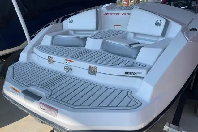 Slide: The Image of 2016 Scarab 165 G boat with Rotax engine, featuring a sleek white and gray design. - 3