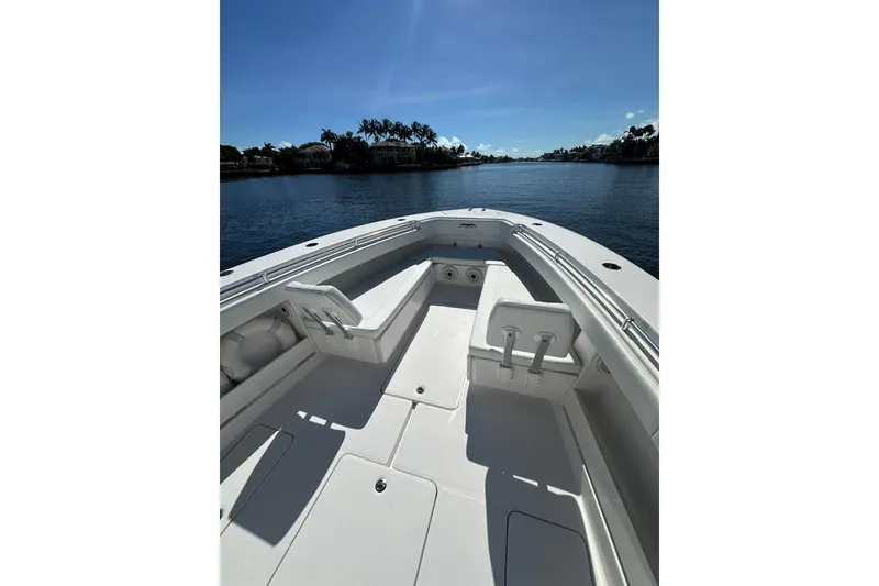 Slide: The Image of 2020 Invincible 39 Open Fisherman boat on calm water under clear blue sky. - 10