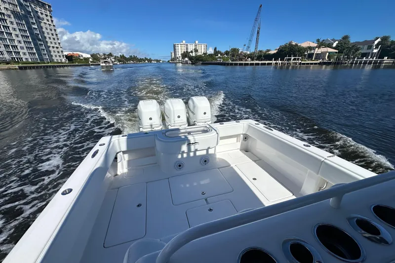 Slide: The Image of 2020 Invincible 39 Open Fisherman boat cruising on a sunny waterway. - 12