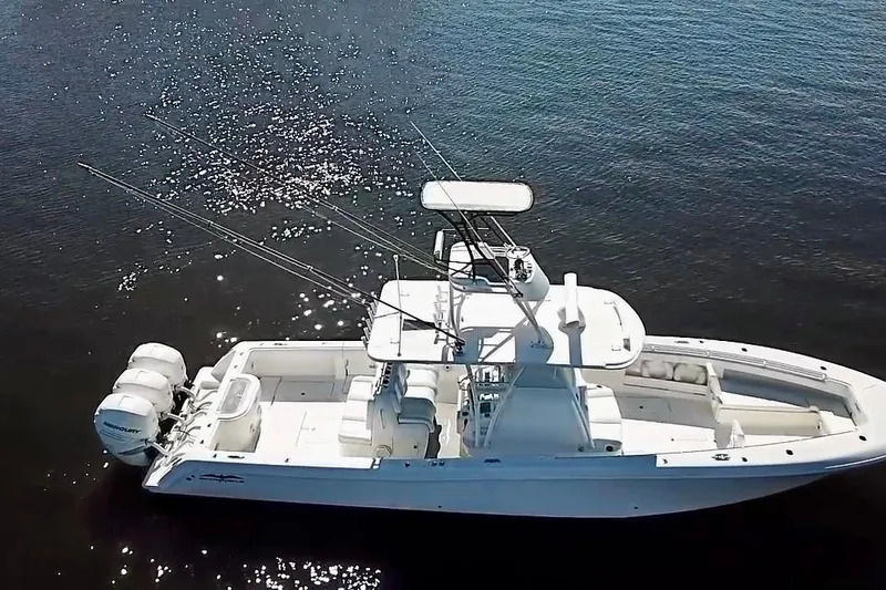 Slide: The Image of 2020 Invincible 39 Open Fisherman boat on calm water, aerial view. - 5