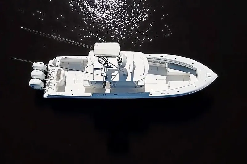 Slide: The Image of 2020 Invincible 39 Open Fisherman boat, aerial view on dark water. - 6