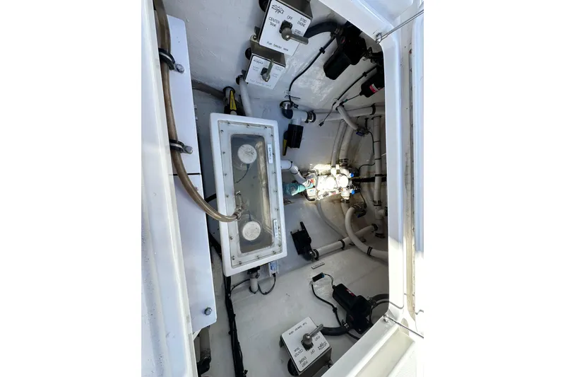 Slide: The Image of 2020 Invincible 39 Open Fisherman boat interior with visible wiring and components. - 8