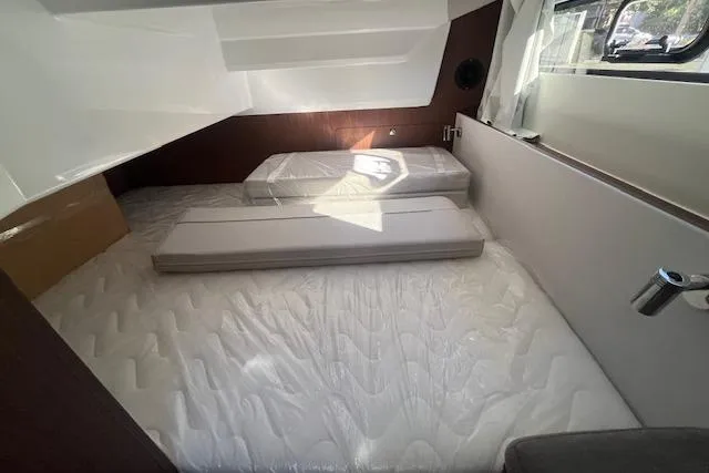Slide: The Image of Interior cabin of 2026 Beneteau Antares 9 V2 with comfortable bedding. - 10