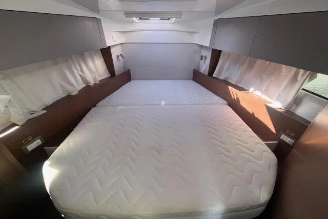 Slide: The Image of Interior cabin of 2026 Beneteau Antares 9 V2 with spacious bed and modern design. - 17