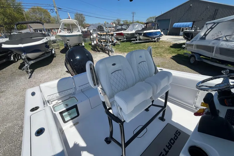 Slide: The Image of 2026 Sportsman Heritage 231 Center Console boat with dual seats and modern design. - 16
