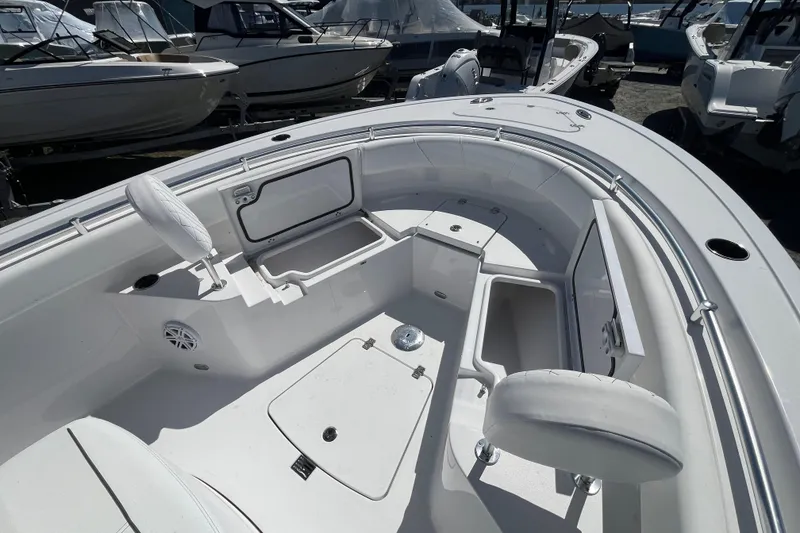 Slide: The Image of 2026 Sportsman Heritage 231 Center Console boat interior with open storage compartments. - 18