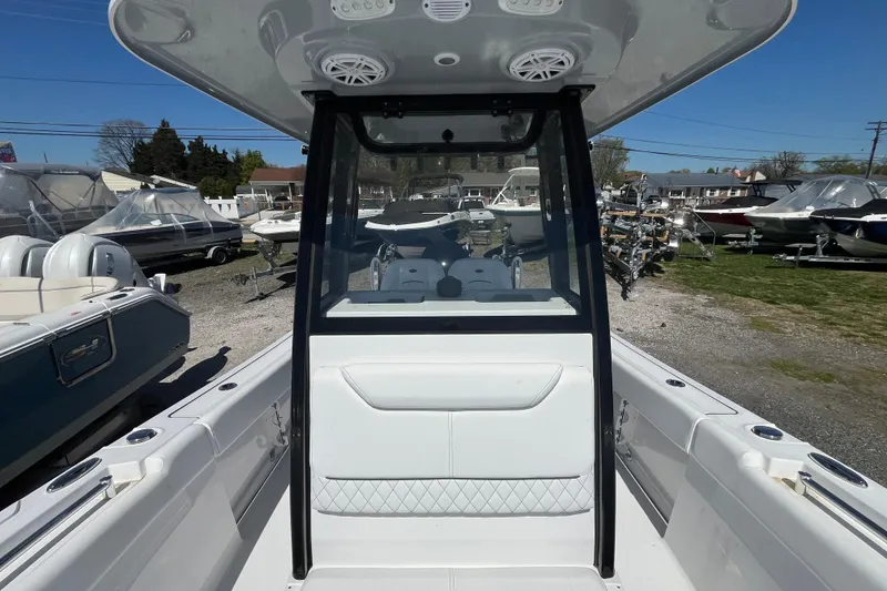 Slide: The Image of 2026 Sportsman Heritage 231 Center Console boat displayed at a marina. - 19