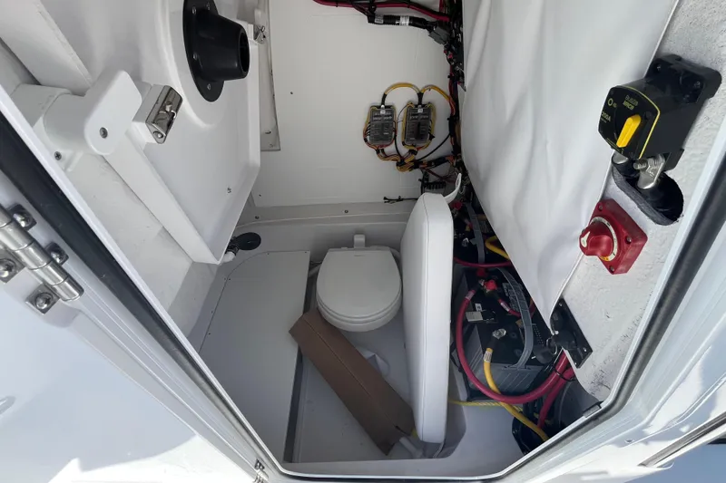 Slide: The Image of Interior view of 2026 Sportsman Heritage 231 Center Console boat's utility compartment. - 22