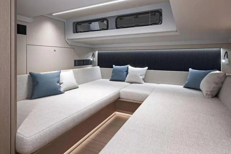 Slide: The Image of 2026 Beneteau Gran Turismo 40 yacht cruising near a scenic coastline. - 5