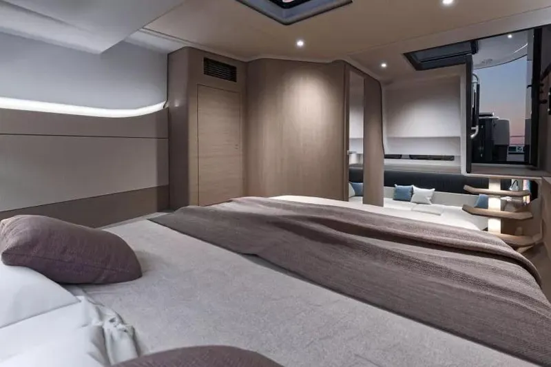 Slide: The Image of 2026 Beneteau Gran Turismo 40 yacht cruising near scenic coastline. - 7