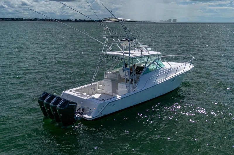 Slide: The Image of 2014 SeaVee 430 boat on open water with multiple outboard engines. - 17