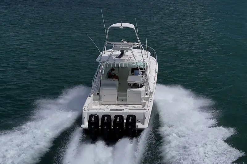 Slide: The Image of 2014 SeaVee 430 boat cruising on open water with powerful engines. - 2