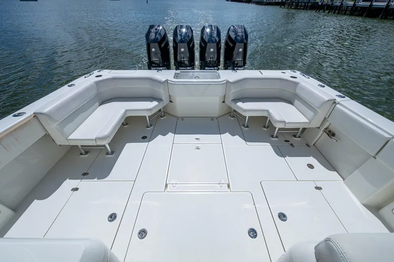 Slide: The Image of 2014 SeaVee 430 boat deck with seating and four outboard engines. - 29