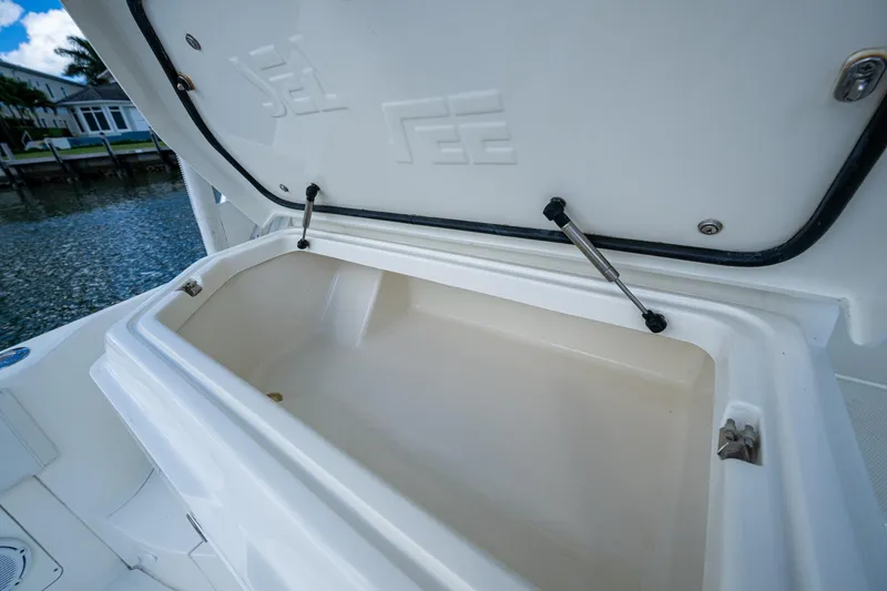 Slide: The Image of Open storage compartment on 2014 SeaVee 430 boat, showcasing spacious interior design. - 35