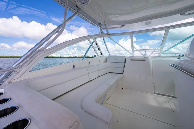 Slide: The Image of Luxurious interior of 2014 SeaVee 430 boat with white seating and panoramic windows. - 38
