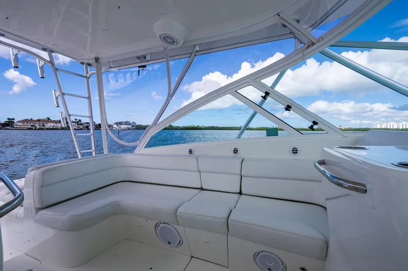 Slide: The Image of Luxurious 2014 SeaVee 430 boat interior with white seating and ocean view. - 39