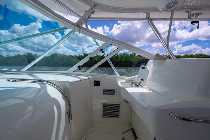 Slide: The Image of Interior view of 2014 SeaVee 430 boat with sleek design and scenic water backdrop. - 40