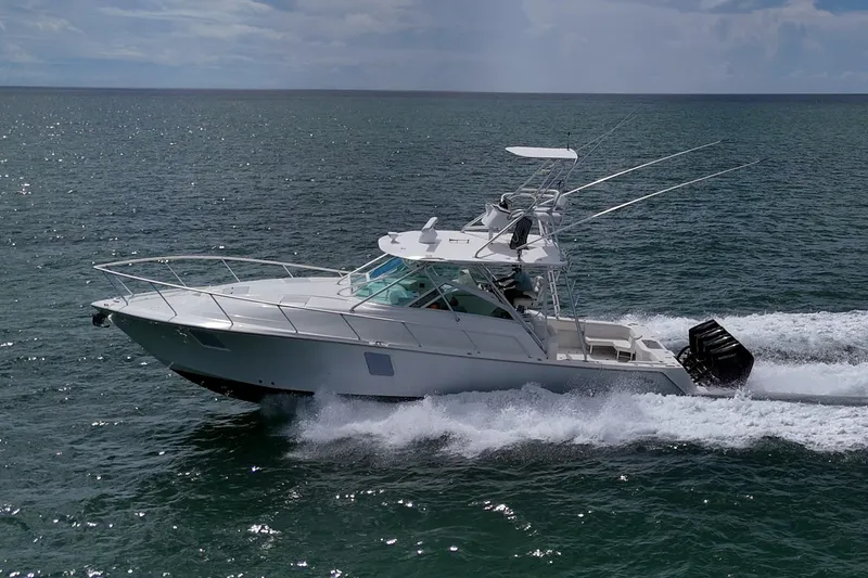 Slide: The Image of 2014 SeaVee 430 boat cruising on open water, side view. - 5