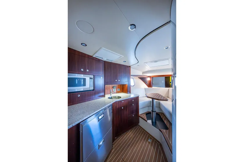 Slide: The Image of Luxurious interior of 2014 SeaVee 430 yacht with modern kitchen and seating area. - 50