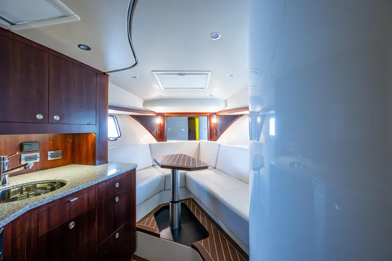 Slide: The Image of Luxurious interior of 2014 SeaVee 430 yacht with modern kitchen and seating area. - 51