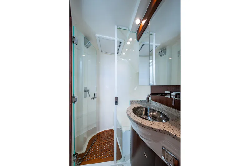 Slide: The Image of Luxurious bathroom in 2014 SeaVee 430 yacht with modern fixtures and glass shower. - 57