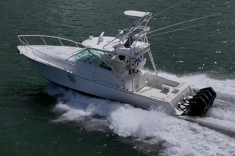 Slide: The Image of 2014 SeaVee 430 boat cruising on water with powerful outboard engines. - 6