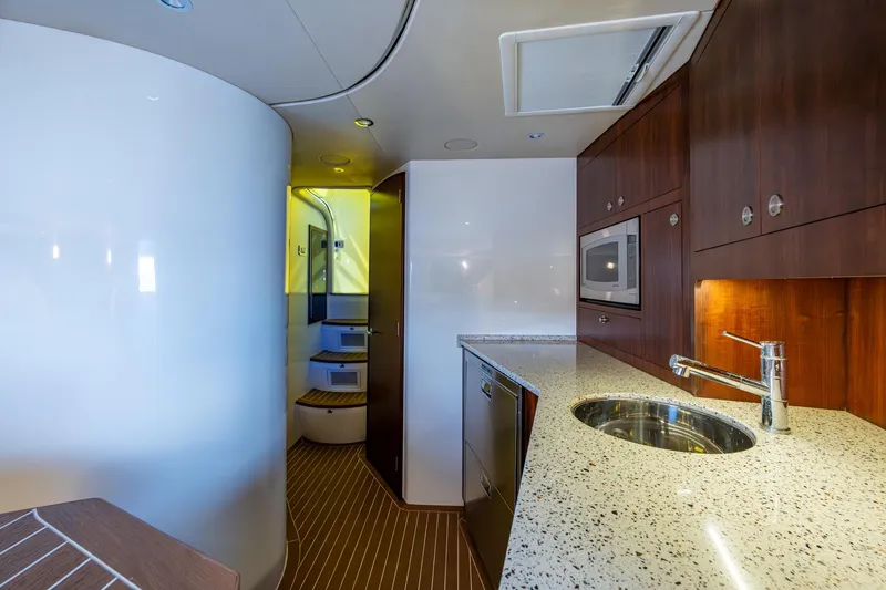 Slide: The Image of Luxurious interior of 2014 SeaVee 430 yacht with modern kitchen amenities. - 61