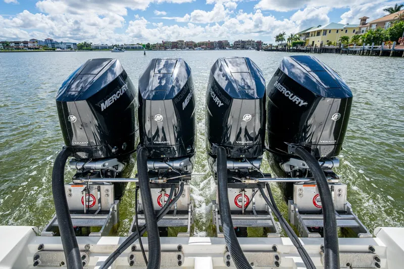 Slide: The Image of Four Mercury Verado outboard engines on a 2014 SeaVee 430 boat, cruising on a sunny day. - 64
