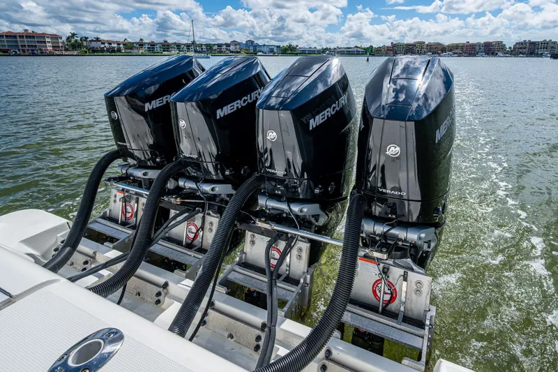 Slide: The Image of 2014 SeaVee 430 boat with four powerful Mercury Verado engines on the water. - 66