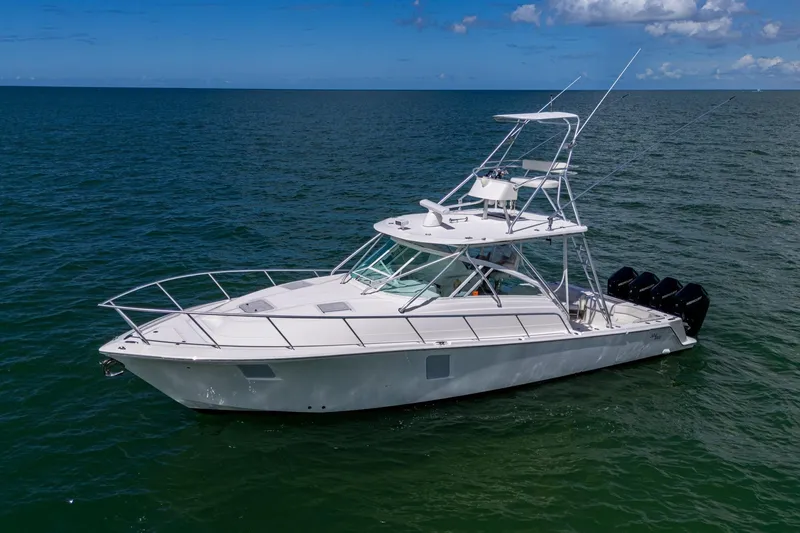 Slide: The Image of 2014 SeaVee 430 boat on open water, featuring multiple outboard engines. - 9