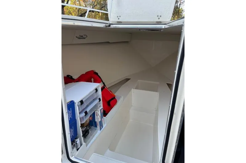 Slide: The Image of 2006 Fountain 38 Tournament Edition boat interior with storage and safety equipment. - 10