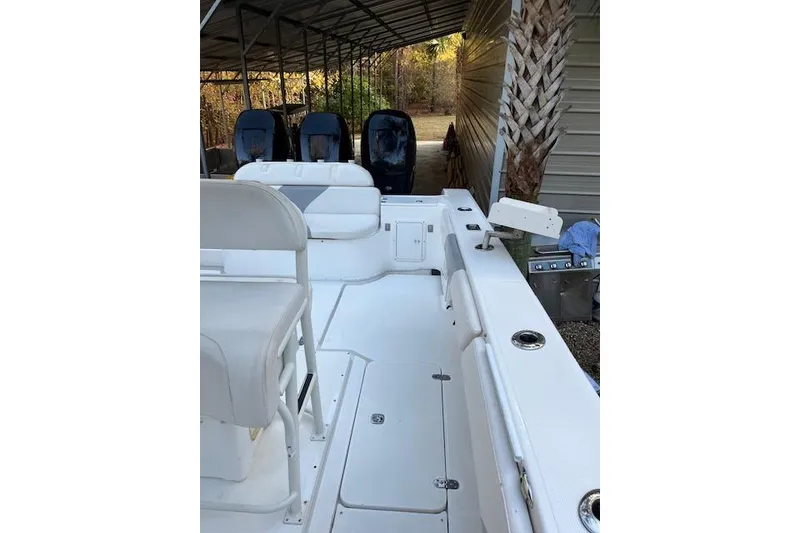 Slide: The Image of 2006 Fountain 38 Tournament Edition boat interior with seating and outboard motors. - 14