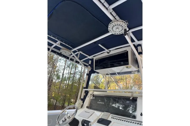 Slide: The Image of 2006 Fountain 38 Tournament Edition boat interior with navigation equipment and canopy. - 5