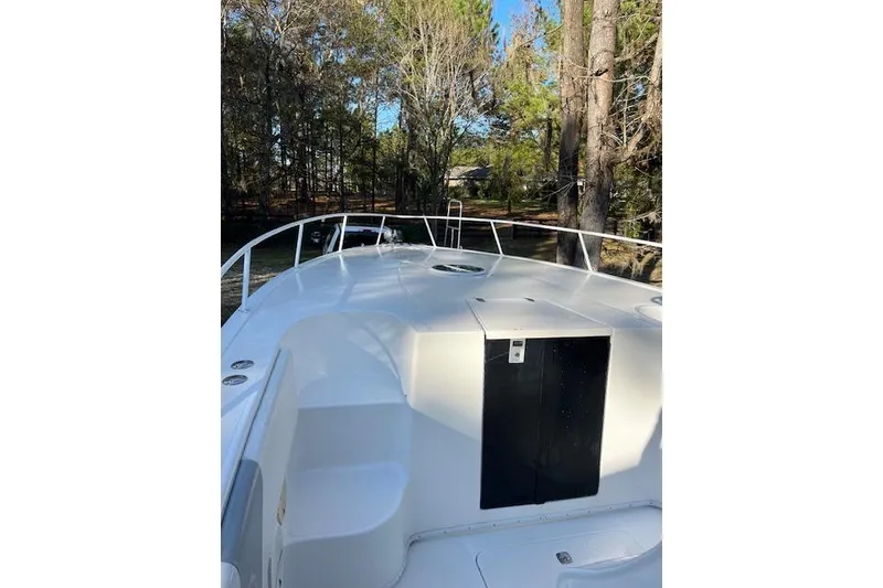 Slide: The Image of 2006 Fountain 38 Tournament Edition boat deck in a wooded area. - 7